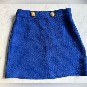 Blue mini skirt with gold buttons